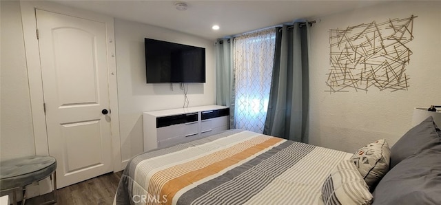 bedroom featuring dark wood-type flooring