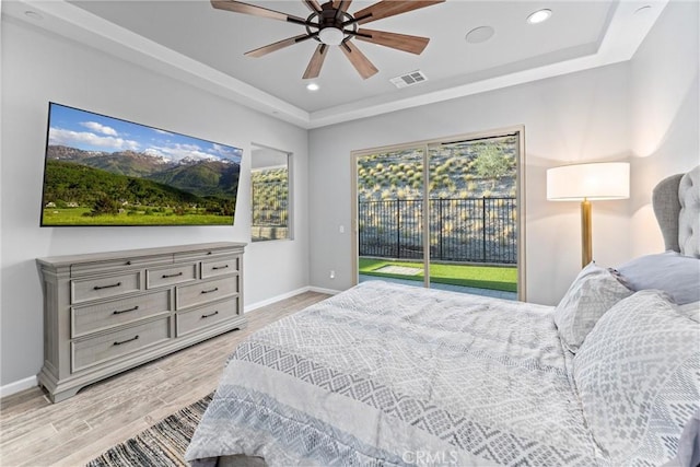 bedroom featuring access to outside, ceiling fan, and light hardwood / wood-style flooring