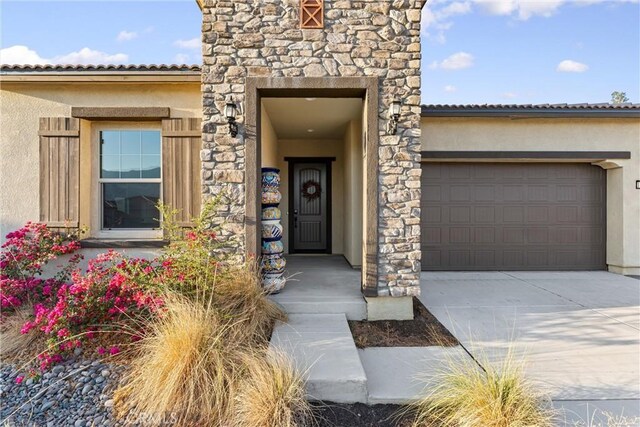 doorway to property featuring a garage