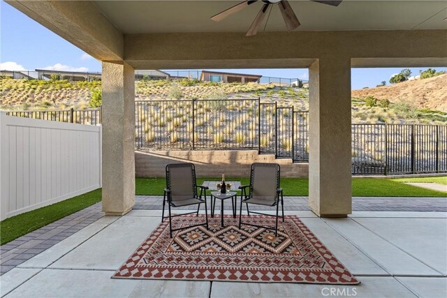 view of patio featuring ceiling fan