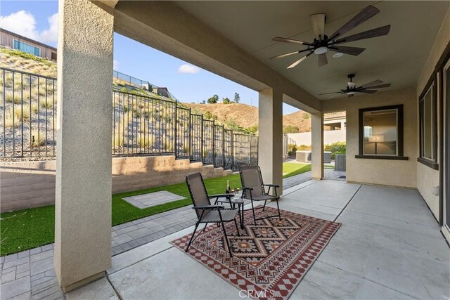 view of patio with ceiling fan