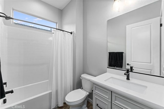 full bathroom featuring toilet, vanity, and shower / tub combo with curtain