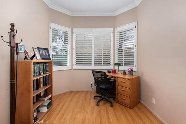 home office with light hardwood / wood-style floors and crown molding