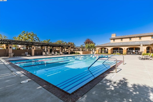 view of swimming pool featuring a patio