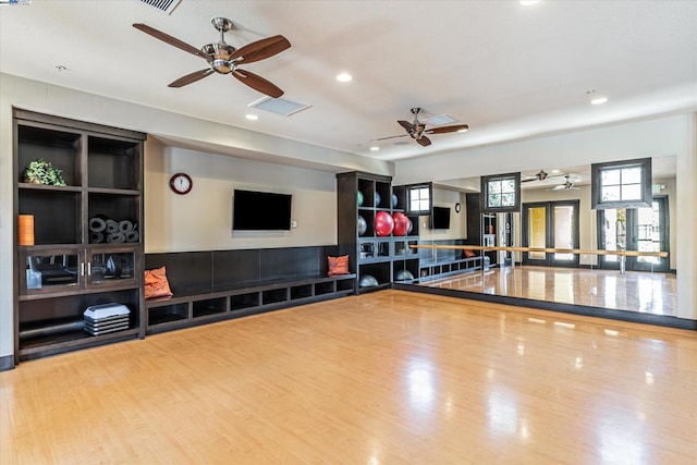 workout room with hardwood / wood-style floors