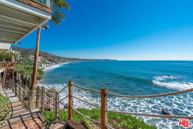 property view of water featuring a beach view