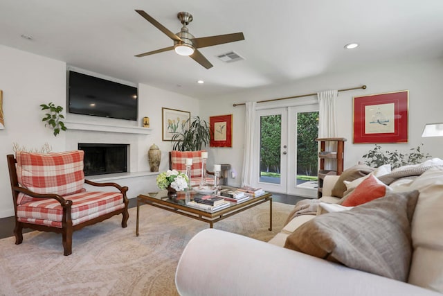 living room with french doors and ceiling fan