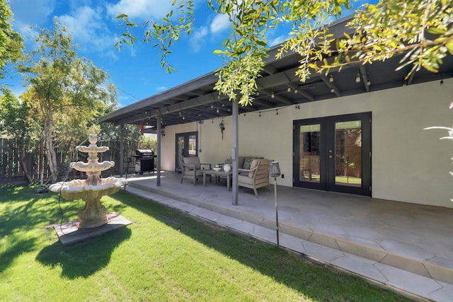 view of yard featuring a patio area, french doors, and an outdoor hangout area