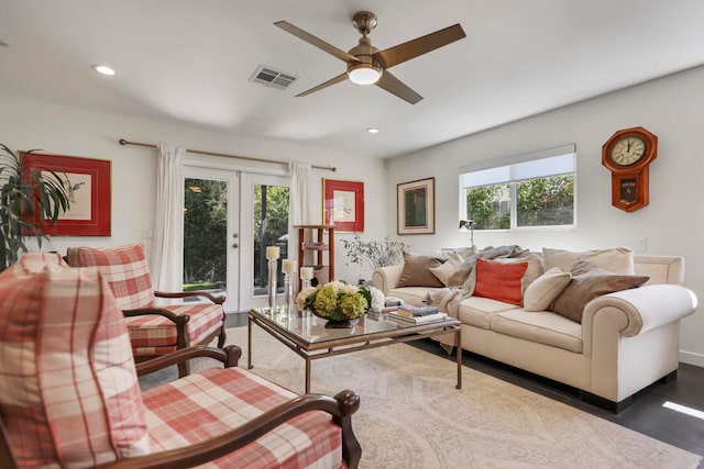 living room featuring french doors, dark hardwood / wood-style floors, a healthy amount of sunlight, and ceiling fan