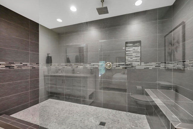 bathroom with tiled shower