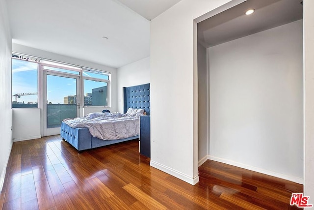 bedroom featuring dark hardwood / wood-style flooring