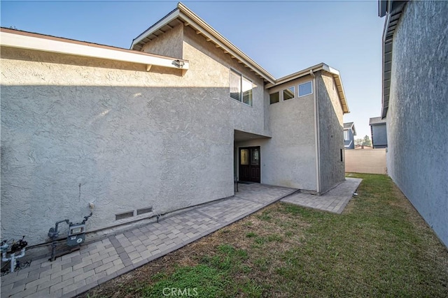 rear view of house featuring a patio area