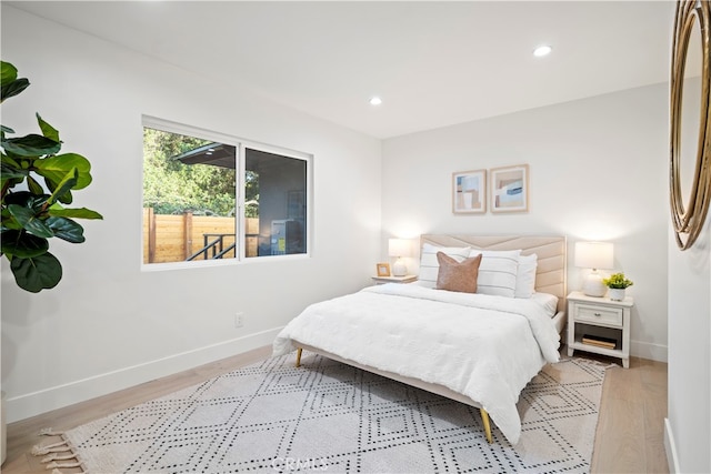 bedroom with light hardwood / wood-style flooring