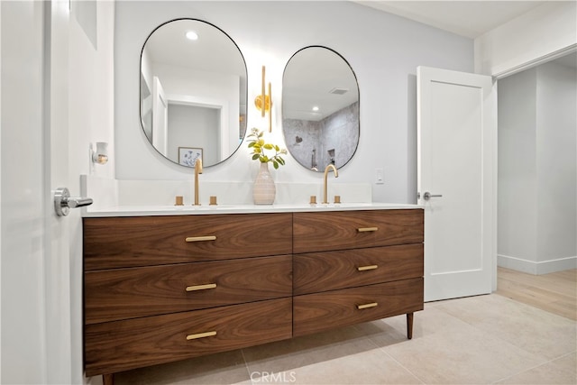 bathroom with vanity and tile patterned flooring