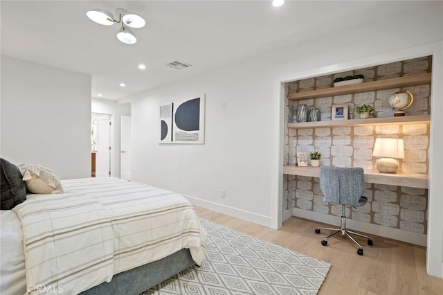 bedroom with light hardwood / wood-style floors