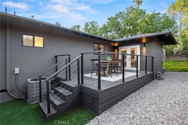 wooden deck featuring central AC unit