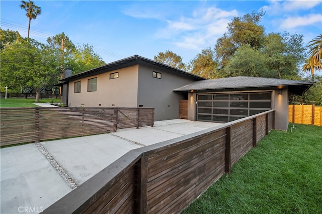 view of front of house featuring a sunroom, a patio area, and a front lawn