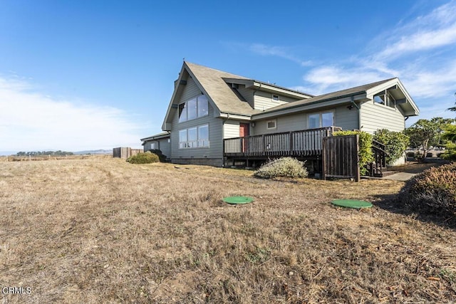 view of side of home featuring a deck