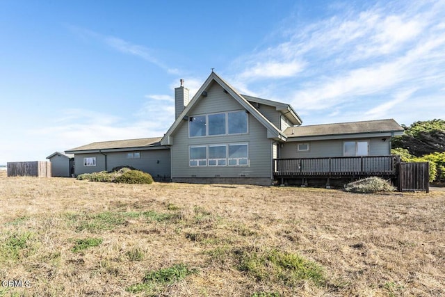 back of property with a wooden deck