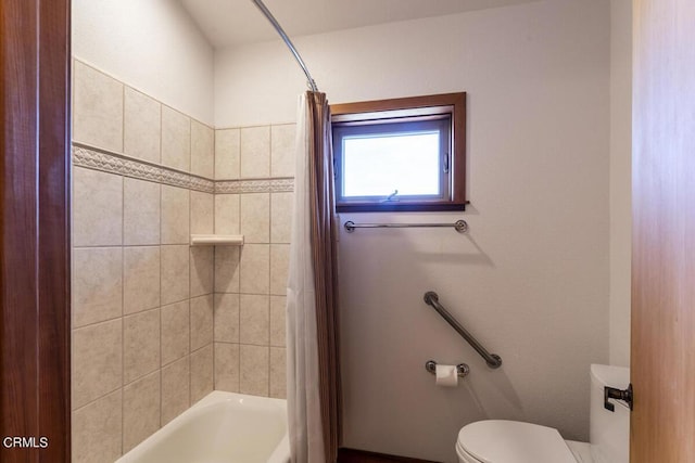 bathroom with toilet and shower / tub combo with curtain