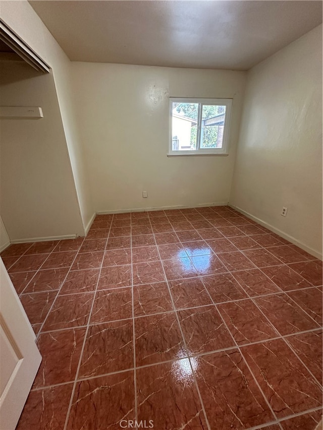 view of tiled spare room