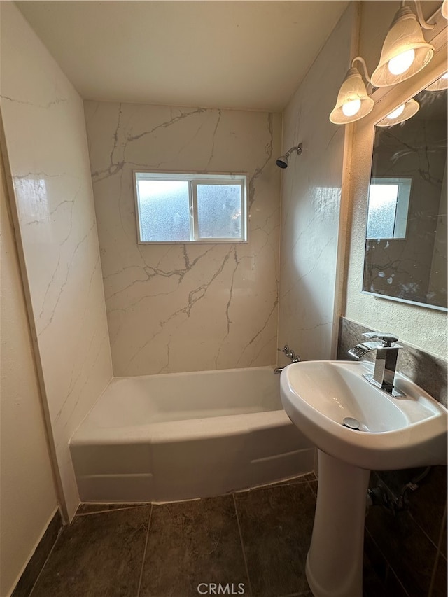 bathroom with tile patterned floors and tiled shower / bath combo