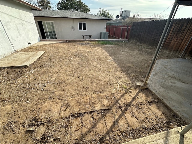 view of yard featuring central AC