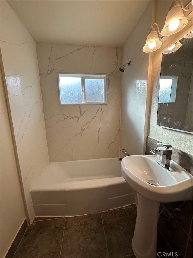 bathroom featuring tiled shower / bath combo and tile patterned floors