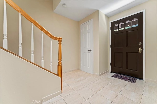 entrance foyer featuring light tile patterned flooring