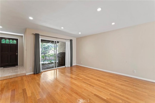 unfurnished room featuring light hardwood / wood-style floors