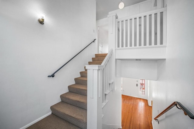 stairway with wood-type flooring