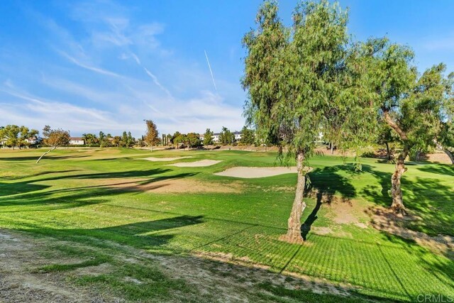 view of property's community with a lawn