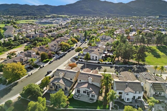 birds eye view of property with a mountain view