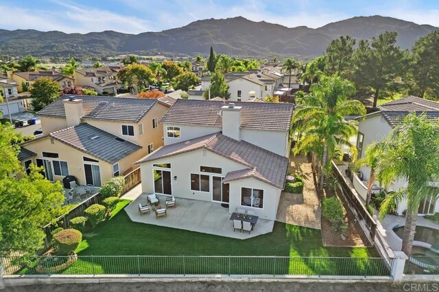 birds eye view of property with a mountain view