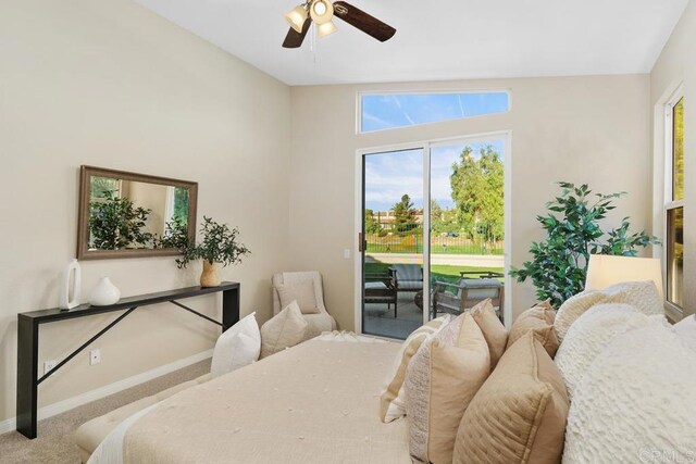 bedroom with ceiling fan, access to exterior, carpet floors, and lofted ceiling