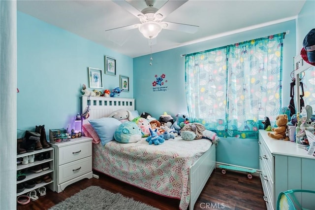 bedroom with dark hardwood / wood-style floors and ceiling fan