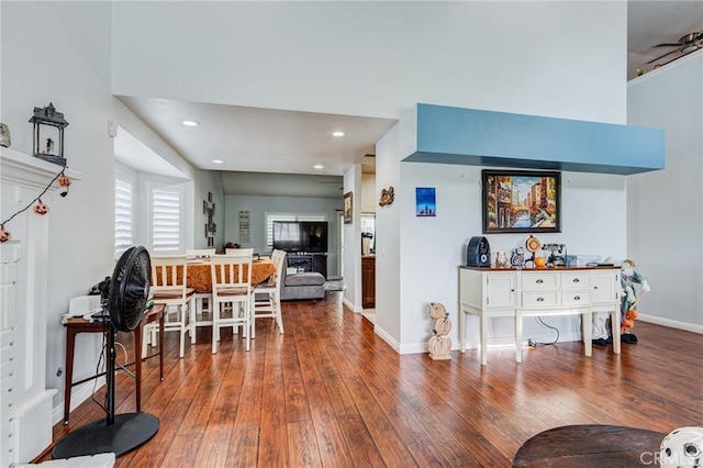 living room featuring ceiling fan and wood-type flooring