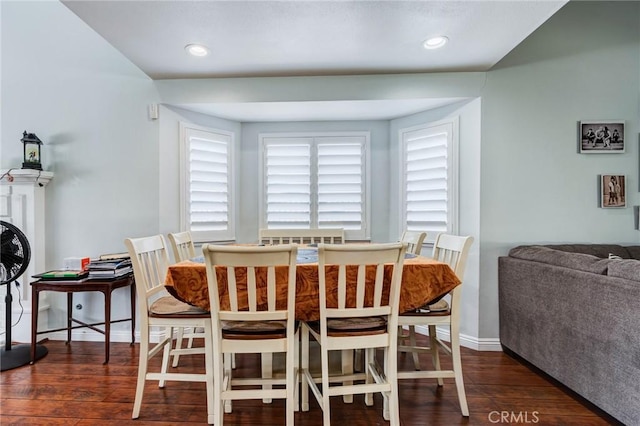 dining space with dark hardwood / wood-style floors