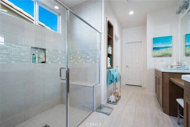 bathroom with vanity and an enclosed shower