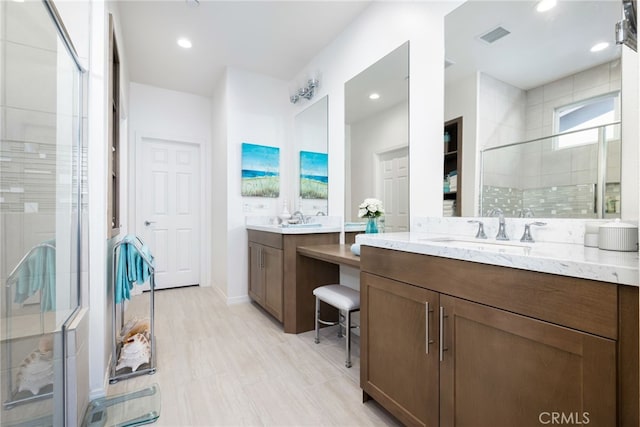 bathroom featuring vanity and walk in shower