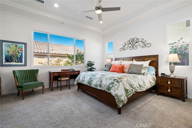 carpeted bedroom featuring ceiling fan and ornamental molding