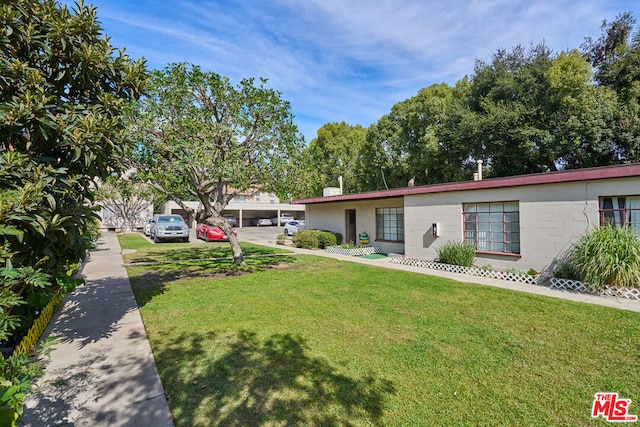 ranch-style house featuring a front lawn