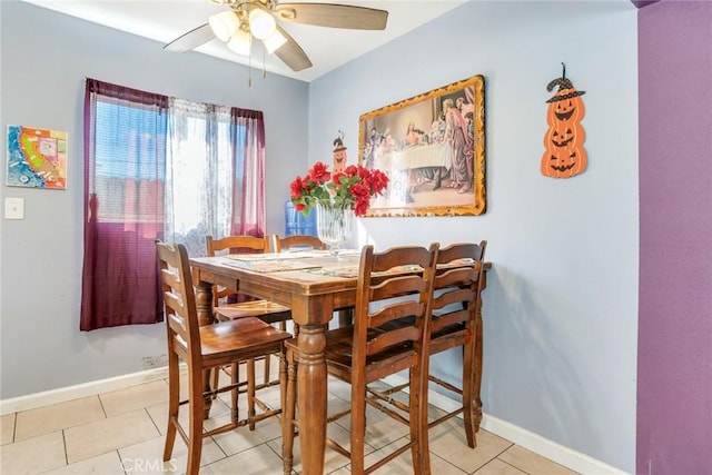 dining room with ceiling fan and light tile patterned floors