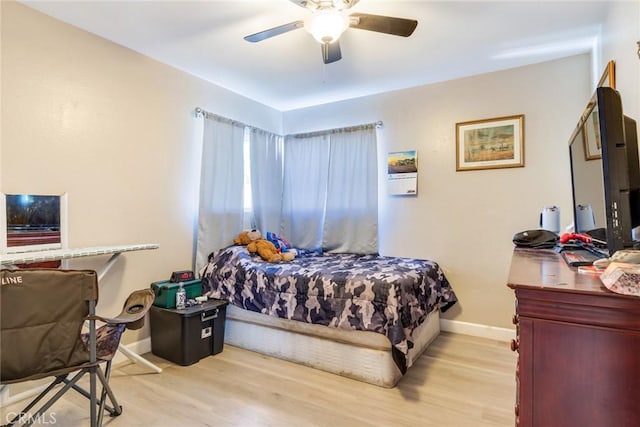 bedroom featuring ceiling fan and light hardwood / wood-style floors