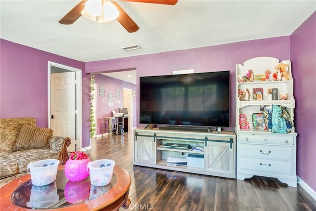 living room with dark hardwood / wood-style flooring