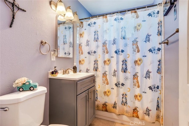 full bathroom featuring toilet, vanity, shower / tub combo, and tile patterned flooring