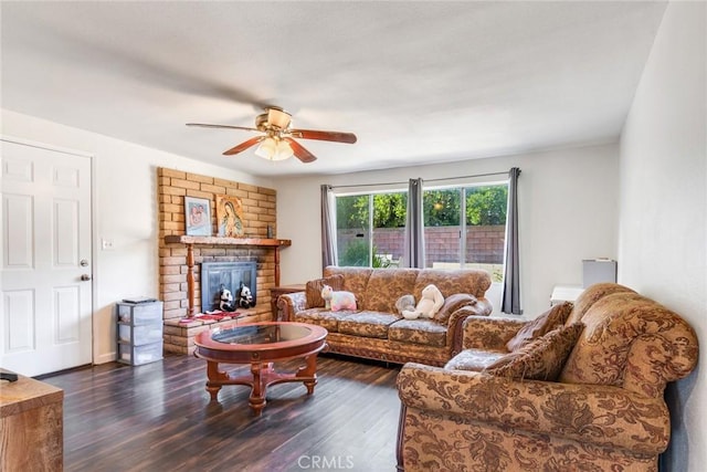 living room with ceiling fan, dark hardwood / wood-style flooring, and a fireplace