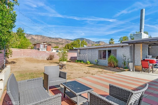 view of patio / terrace with a mountain view