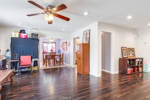 miscellaneous room featuring ceiling fan and dark hardwood / wood-style floors