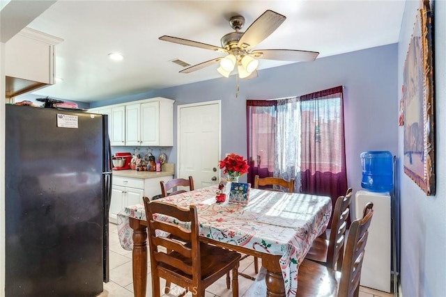 dining area featuring ceiling fan and light tile patterned floors